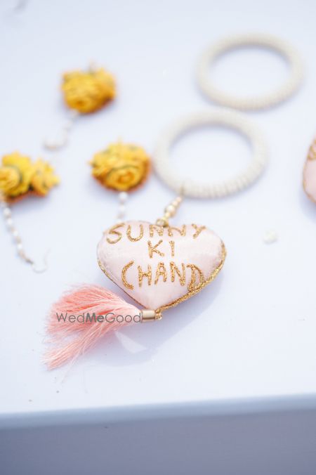 Photo of wedding hashtag on jewellery