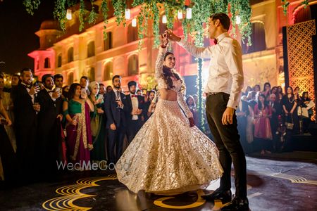 Photo of Bride and groom performing first dance.