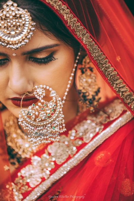 Photo of Oversized bridal nosering with matching maangtikka