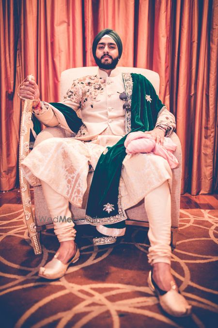 Groom Wedding Dresses Photo emerald green stole on groom on gold and beige self sherwani