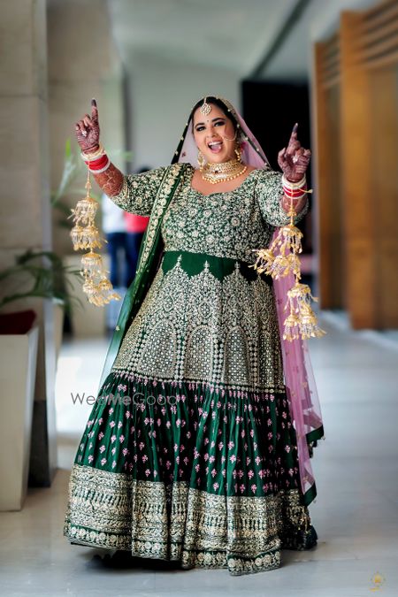 Photo of bridal look in green anarkali for plus size bride