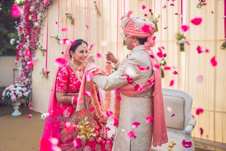 Photo of Couple exchanging jaimalas with their vows!