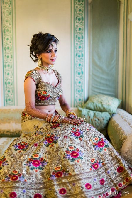 Photo of royal gold bridal lehenga with threadwork and zardozi