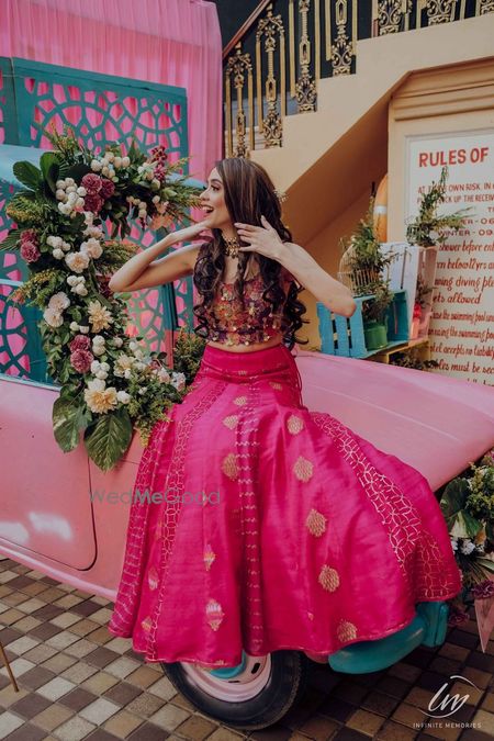 Photo of bride in simple bright pink lehenga for mehendi