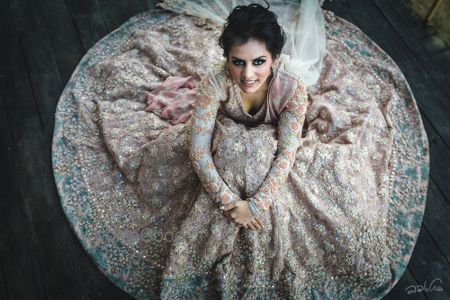 Photo of Bridal portrait idea with Sabyasachi lehenga flared out