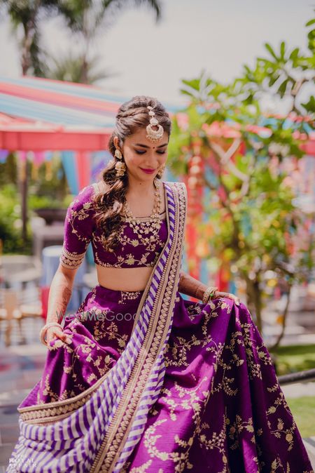 Photo of A bride in purple lehenga