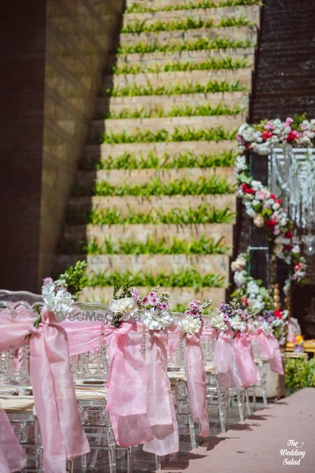 Photo of light pink chair decor theme with florals