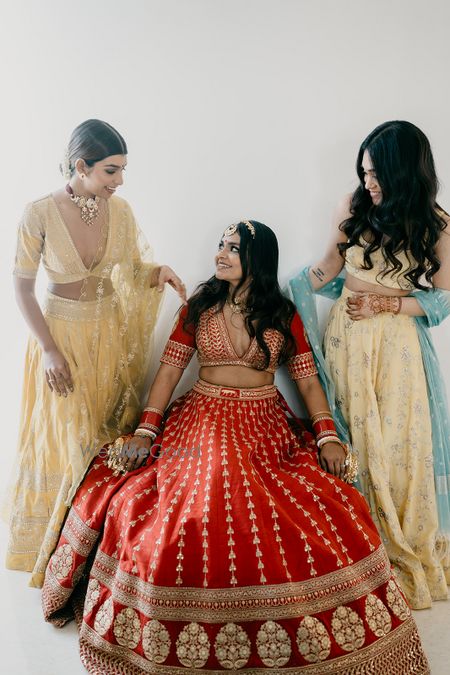 Photo of Bride in Sabyasachi with bridesmaids