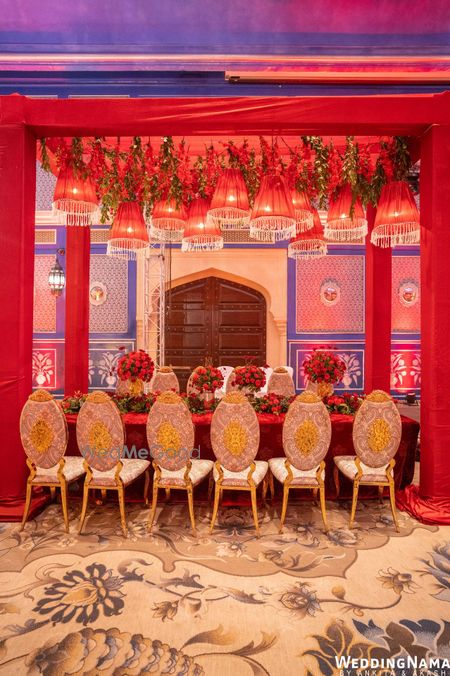 Photo of regal table setting idea with red and gold decor