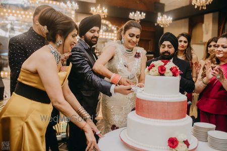 Photo of peach and white three tier wedding floral cake