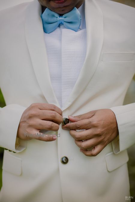 Photo of Groomwear idea with light blue bow tie with suit