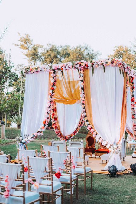 Photo of simple pink and white mandap for an intimate wedding