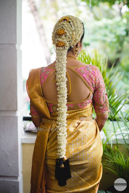 Photo of South Indian traditional bridal hairstyle with mogra flowers