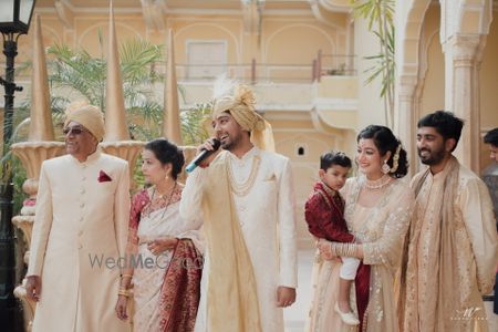 Photo of groom raising a toast on his wedding day