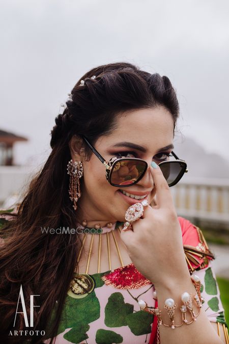 Photo of Happy bride shot with bride wearing sunglasses