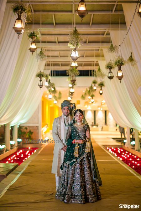 Photo of A bride and groom pose together on their wedding day