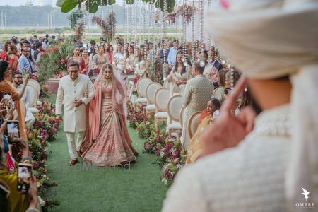 Photo of bride walking down the aisle with her father