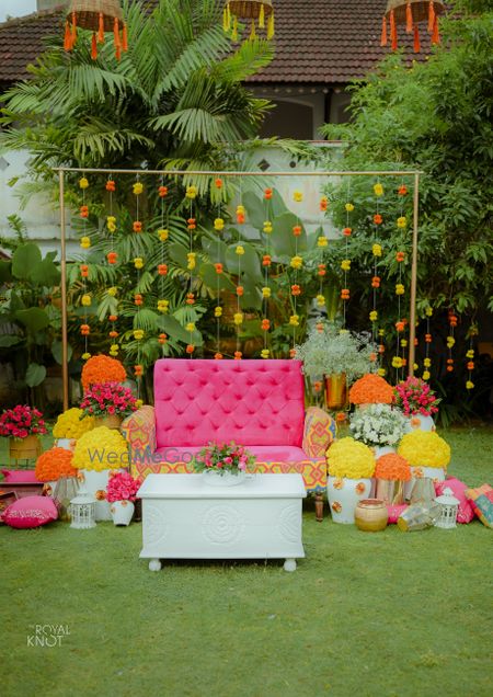 Photo of cute mehendi backdrop with colourful elements for home decor