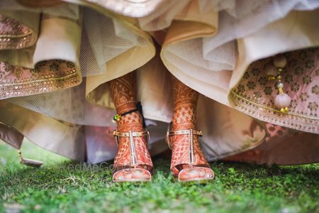 Photo of Pretty gold sandals with jeweled detailing