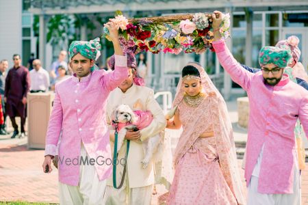 Photo of Bride entering with brothers and her dog