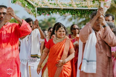 Photo of bridal entry with bride and her relatives