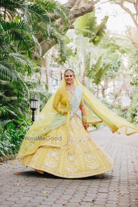 Photo of Offbeat bridal lehenga in yellow and mint colours