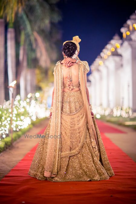 Photo of Bridal back on rose gold sequin lehenga