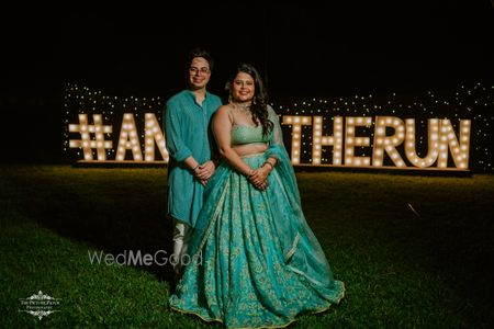 Photo of couple twinning in blue on mehendi