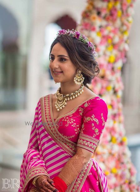 Photo of Mehendi bridal hairdo with floral wreath