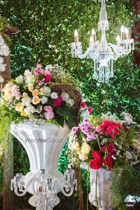 Photo of floral decor idea for wedding with hanging chandelier