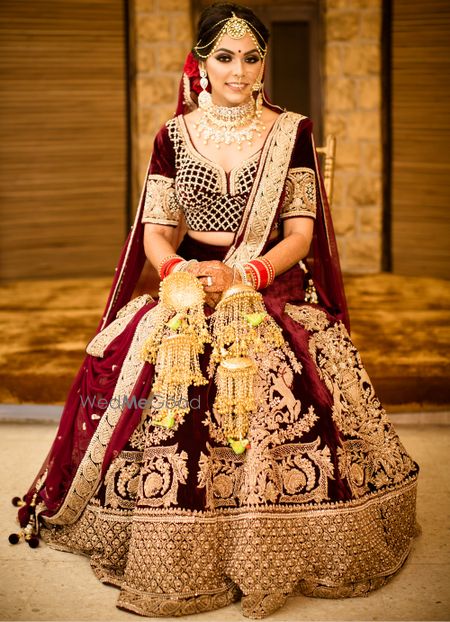 Photo of Winter wedding velvet maroon lehenga