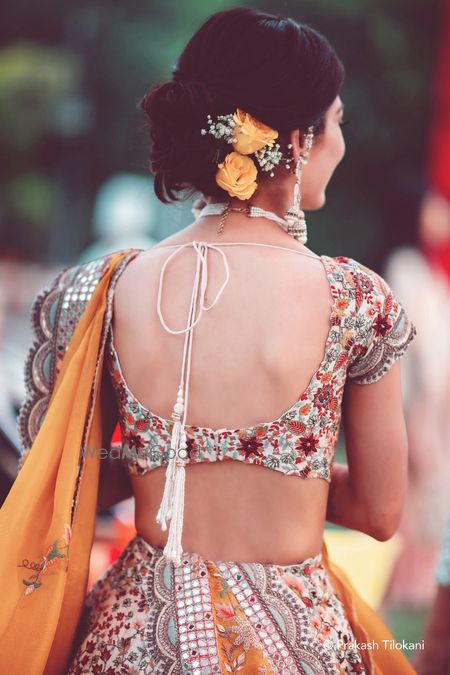 Photo of bridal back shot with scalloped blouse design