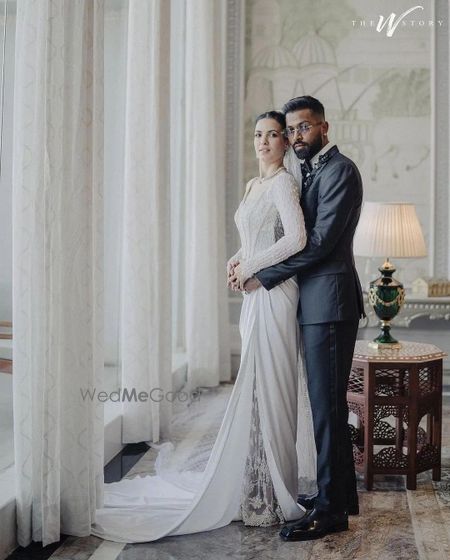 Photo of Hardik & Natasa couple pose at their white wedding at Raffles, Udaipur