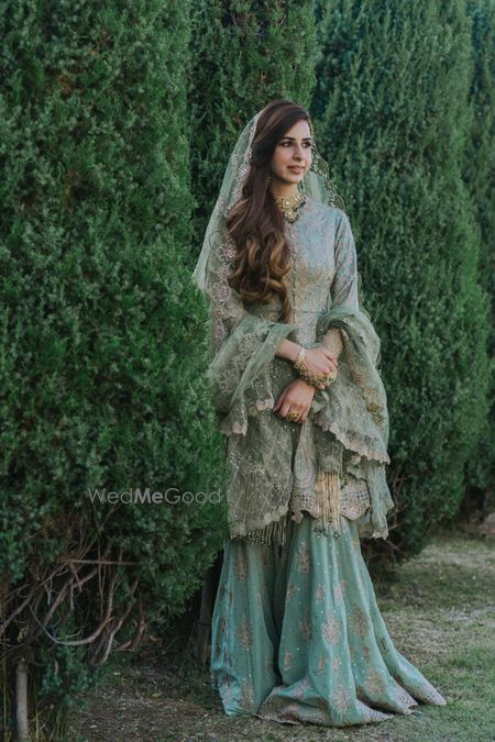 Photo of heavy mint green sharara for nikah ceremony