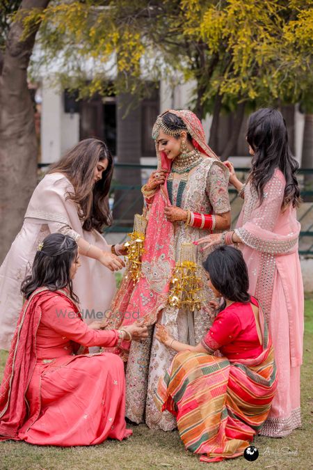 Photo of Coordinated Bridesmaids Candid Portrait With Bride