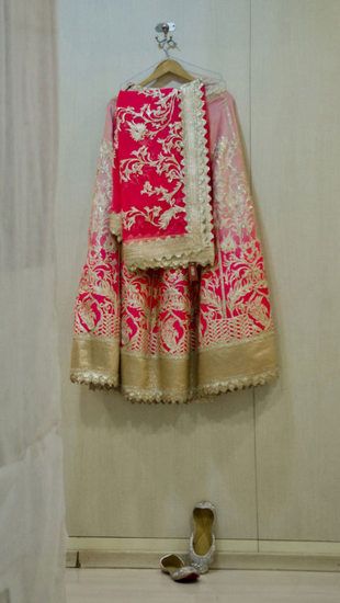 Photo of red and gold lehenga