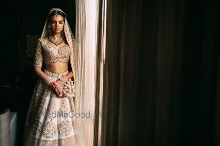 Photo of Off white floral Sabyasachi lehenga