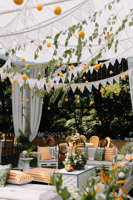 Photo of Gorgeous fruit inspired decor in white and orange for an outdoor event