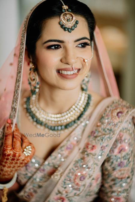 Photo of Bride holding her dupatta and posing.