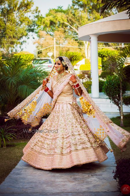 Photo of Sikh Bride in Pastel Pink Twirling Lehenga