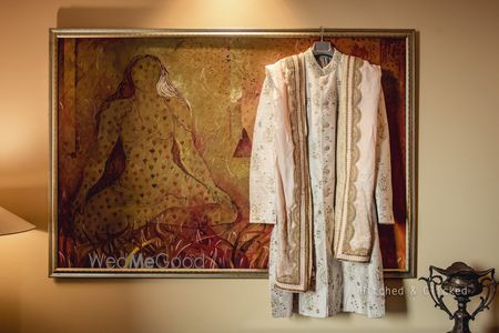 Photo of pastel sherwani on hanger with stole