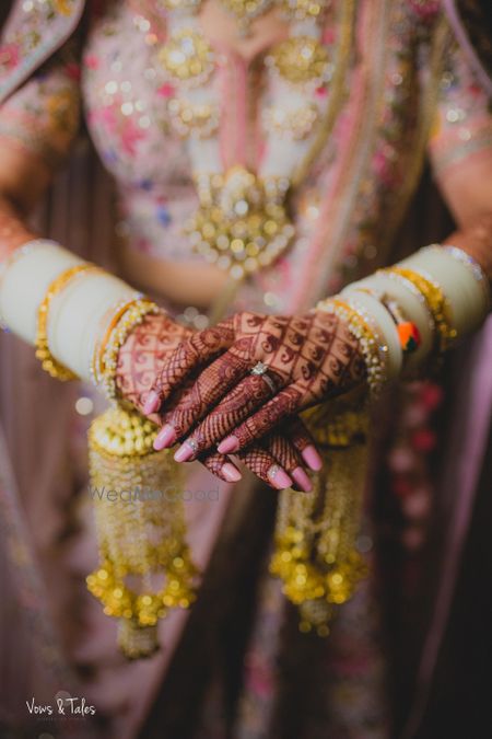 Photo of Bridal close up shot with kaleere and white chura