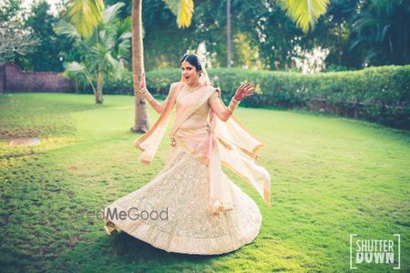 Photo of Twirling bride in pastel