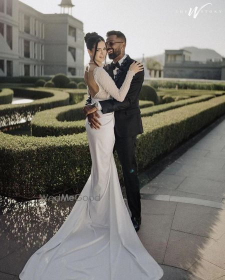 Photo of Hardik & Natasa couple pose at their white wedding at Raffles, Udaipur