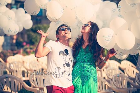 Photo of releasing white balloons on engagement