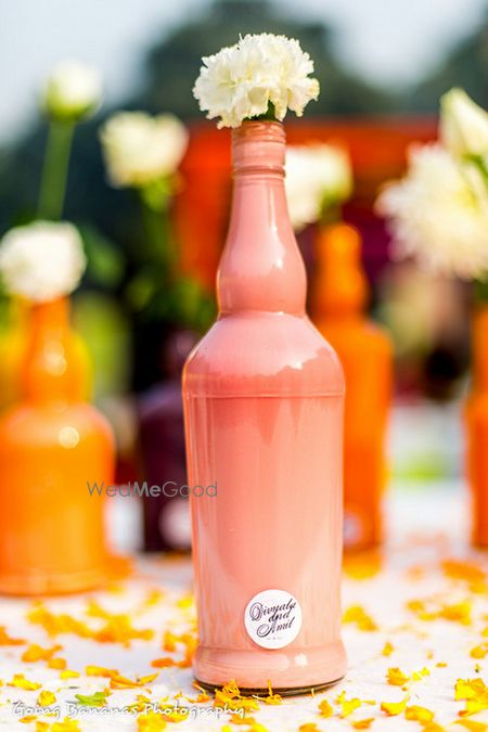 Photo of handpainted bottles as table centerpieces