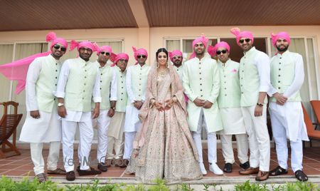 Photo of Perfectly coordinated brothers of the bride with the bride in the centre!