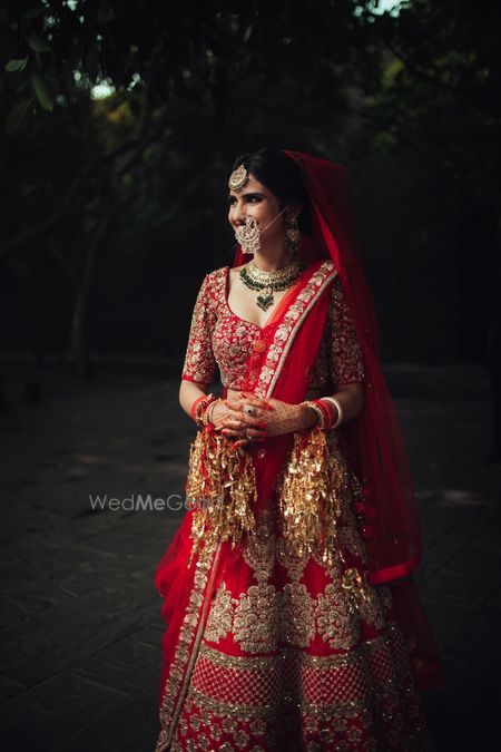 Photo of Bridal portrait of bride in red