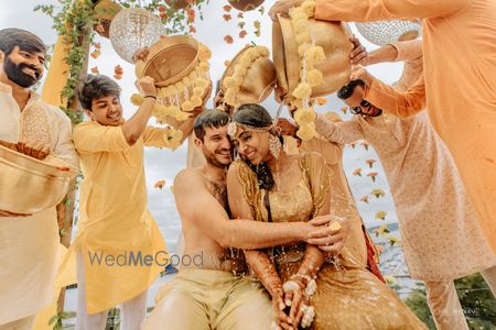 Photo of fun haldi couple portrait