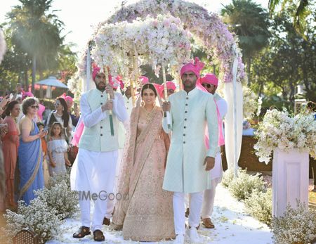 Photo of A bride enters under a gorgeous floral phoolon ki chaadar